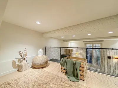 a living room with a dog cage in a room at Old Town - 4 pers, AC in Nice
