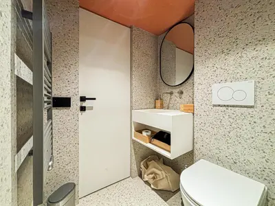 a bathroom with a white toilet and a sink at Old Town - 4 pers, AC in Nice