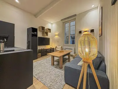 a living room with a couch and a table at Old Town - 4 pers, AC in Nice