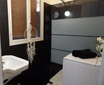 a bathroom with a sink and a white toilet at Studio japonisant in Nice