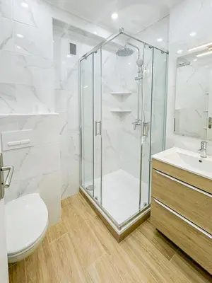 a bathroom with a shower and a toilet and a sink at Gare Du Sud - Wifi, AC, balcon in Nice