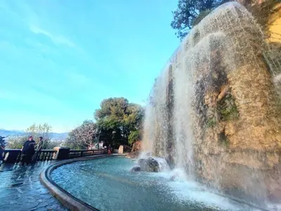 a waterfall in a fountain in a park at Moderne 2/3 Pièces près du Port in Nice