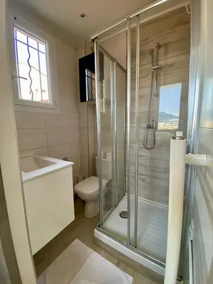 a bathroom with a shower and a toilet at STUDIO VERT FSHH in Nice