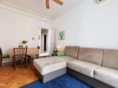 a living room with a couch and a table at Appartement Nice Bellecour in Nice