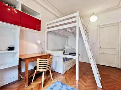a bedroom with a desk and a bunk bed at Appartement Nice Bellecour in Nice