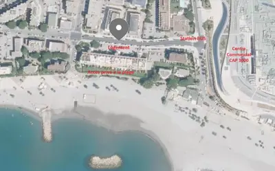 a map of a beach with a black circle on it at Studio cosy front de mer à 5min de Nice in Saint-Laurent-du-Var