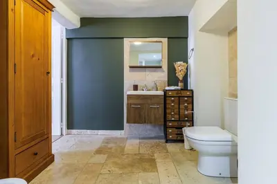 a bathroom with a toilet and a sink and a mirror at Chic Old Town Apartment in Nice