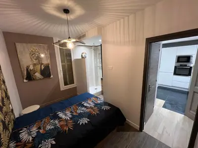 a small bedroom with a bed in a room at Port de Nice belle petite pépite in Nice