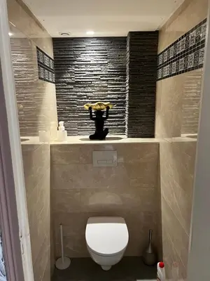 a bathroom with a white toilet in a room at Belle perle rare port de Nice in Nice
