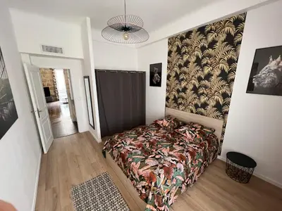 a bedroom with a bed in a room with a ceiling at Belle perle rare port de Nice in Nice