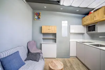 a kitchen with a couch and a table in a room at Maison Bianchi - Jean Médecin in Nice