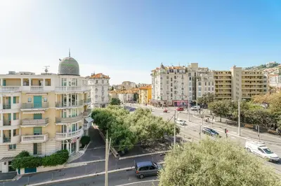 a view of a city with buildings and a street at Terrasse des Oliviers in Nice