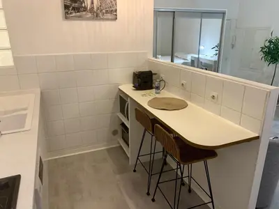 a bathroom with a counter with a sink and a mirror at ApartHotel Riviera - Cocon de Gilly - Old Town Promenade des Anglais in Nice