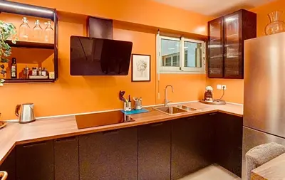 a kitchen with a sink and a refrigerator at Appartement Nice Palais de la Méditerranée in Nice
