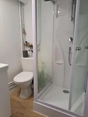 a bathroom with a toilet and a glass shower at Studio coin nuit terrasse à 5 minutes de la plage N1 in Saint-Laurent-du-Var