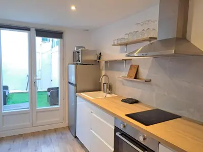a kitchen with a counter and a sink and a window at Studio avec Terrasse à 5 minutes de la plage N6 in Saint-Laurent-du-Var