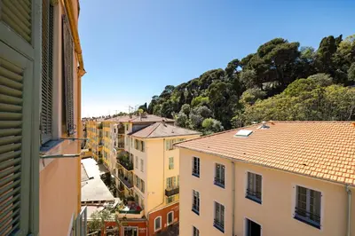 a view of a city with buildings and a mountain at Nice Renting - GAUTIER - Elegance Height Port & Castle Nice in Nice