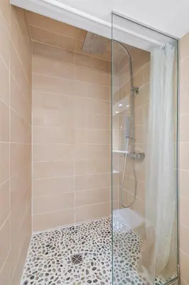 a shower with a glass door in a bathroom at Nice Renting - GAUTIER - Elegance Height Port & Castle Nice in Nice
