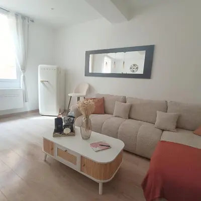 a living room with a couch and a coffee table at Cocooning Atmosphère old Nice in Nice