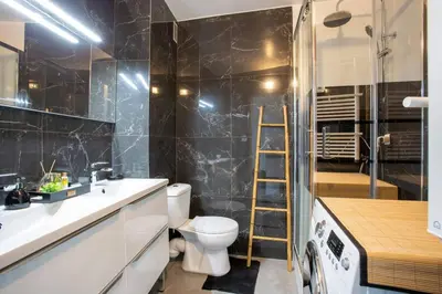 a bathroom with a toilet and a sink and a shower at 4 pièces 8 personnes proche aéroport,tramway in Nice