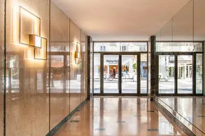 an empty lobby with glass doors and a building at 50 meters from the beach ! Best location in Nice in Nice