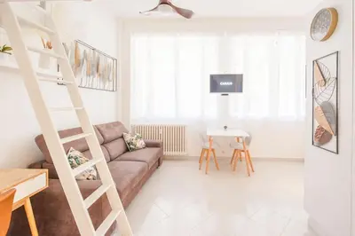 a living room with a couch and a table at 50 meters from the beach ! Best location in Nice in Nice