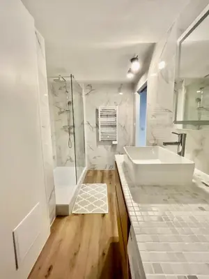 a white bathroom with a tub and a shower at Old Town Lovely Apartment in Nice in Nice