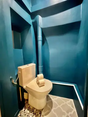 a bathroom with a toilet in a blue room at Old Town Lovely Apartment in Nice in Nice