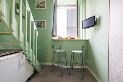a small bar in a room with two stools at MY CASA - SIAGRE 35 - Near main Avenue with AC in Nice