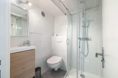 a white bathroom with a toilet and a shower at MY CASA - SIAGRE 35 - Near main Avenue with AC in Nice