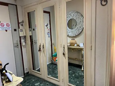 a room with two large mirrors in a room at Nice center Aviva's-home in Nice