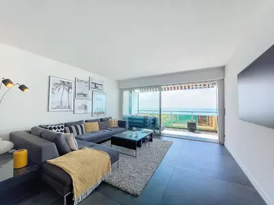 a living room with a couch and a table at Nestor&Jeeves - LE ROYAL LUXEMBOURG - Sea view - Terrace in Nice
