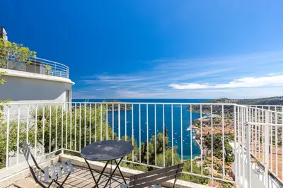 a balcony with a view of the ocean at 73 CORNE D OR - Toit Terrasse - Vue Mer Panoramique - Jaccuzzi in Villefranche-sur-Mer
