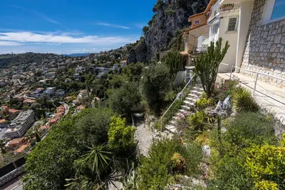 a view of a city from a house at 73 CORNE D OR - Toit Terrasse - Vue Mer Panoramique - Jaccuzzi in Villefranche-sur-Mer