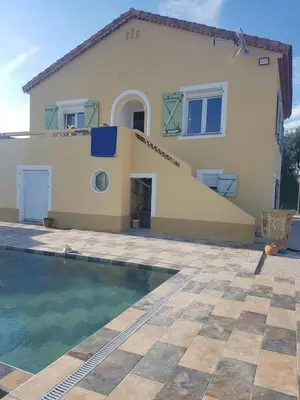 a house with a swimming pool in front of it at Villa moderne avec piscine vue mer à Nice Bellet in Nice