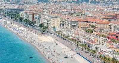 an aerial view of a beach with crowds of people at Villa moderne avec piscine vue mer à Nice Bellet in Nice