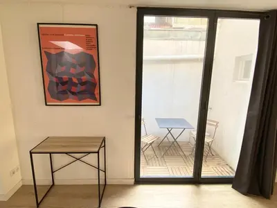 a room with a table and a picture on the wall at Loft - 