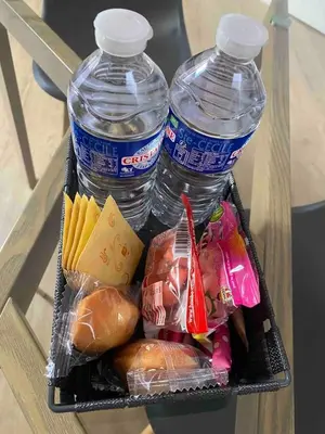 two plastic containers of food and two bottles of water at Loft - 