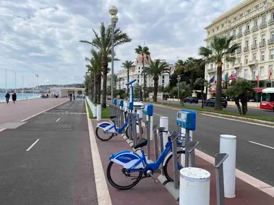 a couple of blue bikes parked next to a street at Loft - 