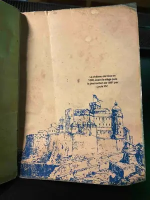 an open book with a drawing of a castle at Loft - 