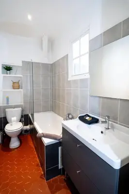 a bathroom with a tub and a toilet and a sink at Magnifique 2p au coeur du vieux Nice in Nice