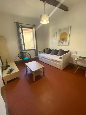 a living room with a couch and a table at Magnifique 2p au coeur du vieux Nice in Nice