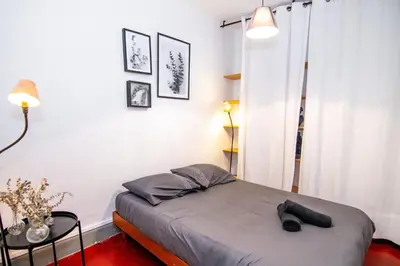 a bedroom with a bed in a room at Magnifique 2p au coeur du vieux Nice in Nice