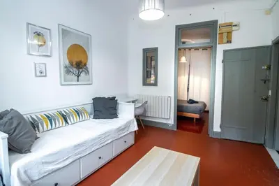 a living room with a white couch in a room at Magnifique 2p au coeur du vieux Nice in Nice