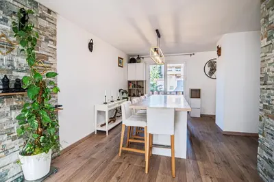 a kitchen with white walls and a table and chairs at Beautiful 3 room apartment - Parking -Centre -Tram in Nice