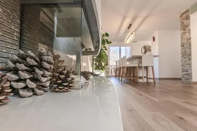 a living room with a stack of pine cones on the floor at Beautiful 3 room apartment - Parking -Centre -Tram in Nice