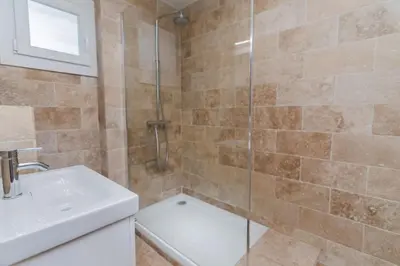 a bathroom with a shower and a toilet and a sink at Beautiful 3 room apartment - Parking -Centre -Tram in Nice