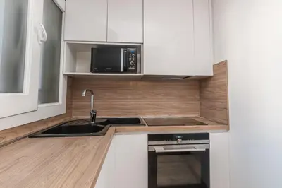 a kitchen with a sink and a microwave at Beautiful 3 room apartment - Parking -Centre -Tram in Nice