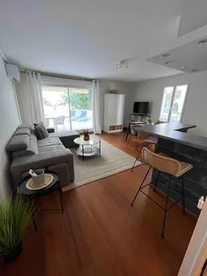 a living room with a couch and a table at Beautiful apartment - Centre in Cagnes-sur-Mer