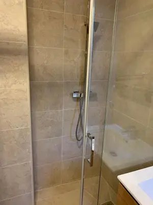 a bathroom with a shower with a glass door at Massena : Hyper Centre Studio 2p in Nice